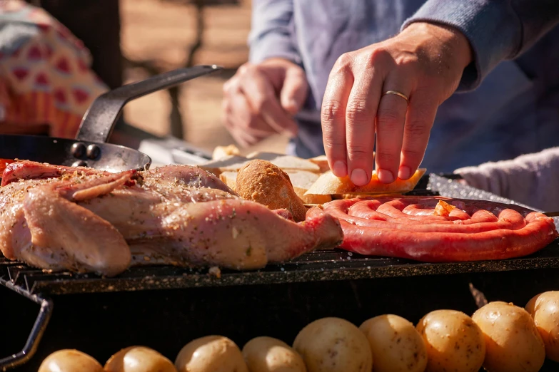 there is food being prepared for the grill