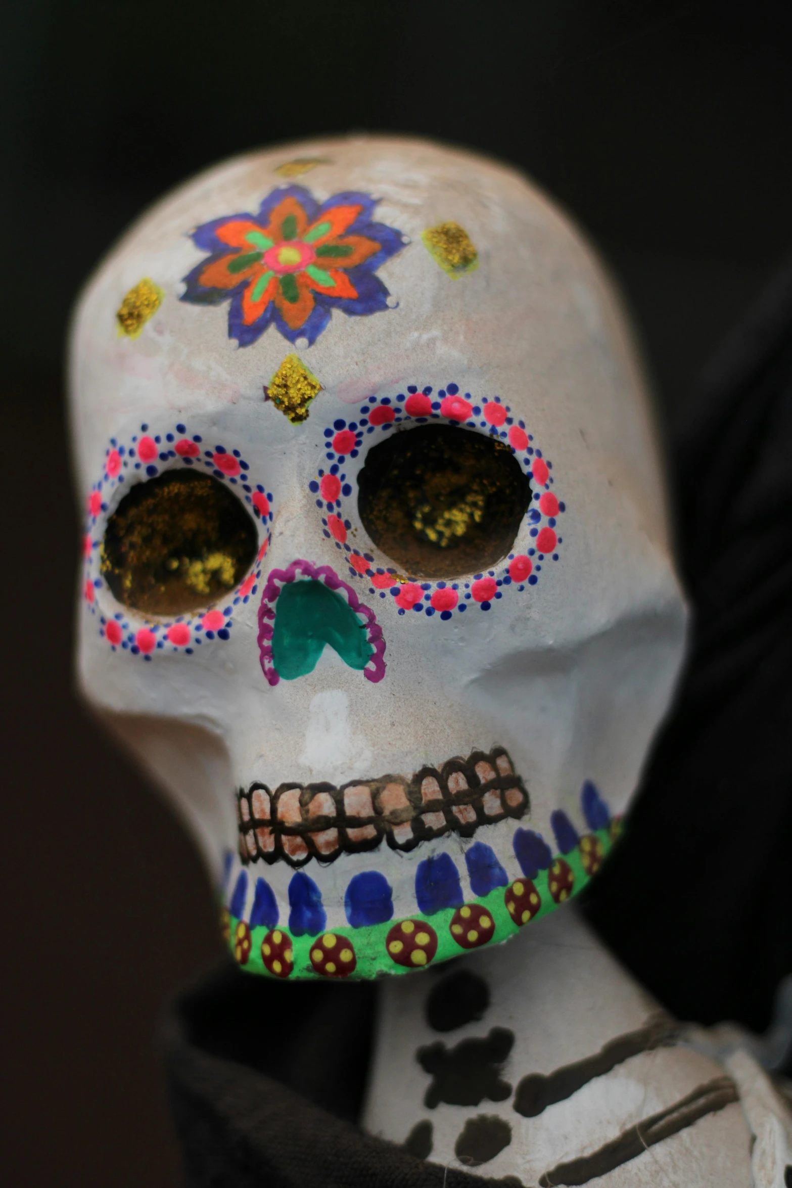 the white skull is decorated with flowers and jewels