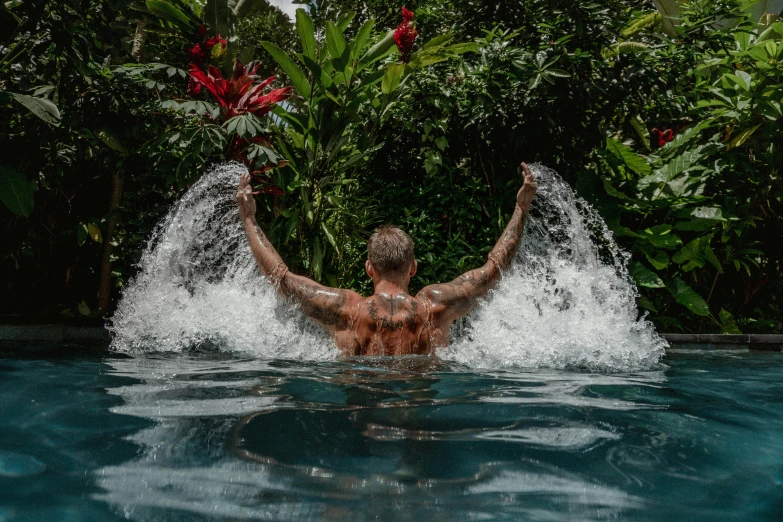 an image of a man swimming in the pool