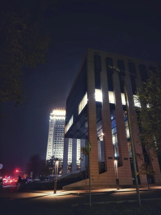 light shining on an office building at night
