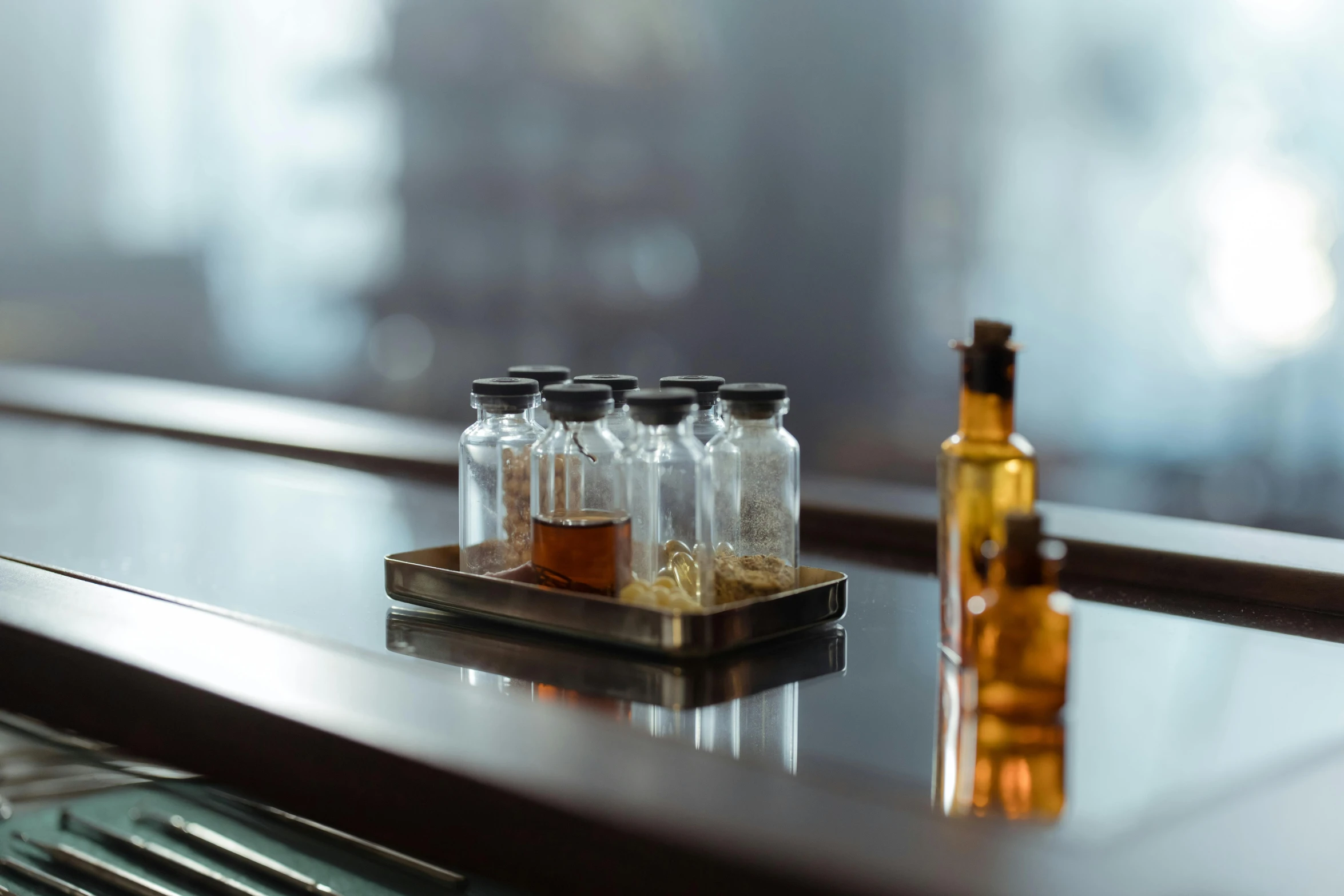 a tray with bottles of various sizes on a table