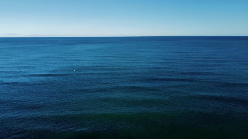 an image of a view of the blue ocean from above