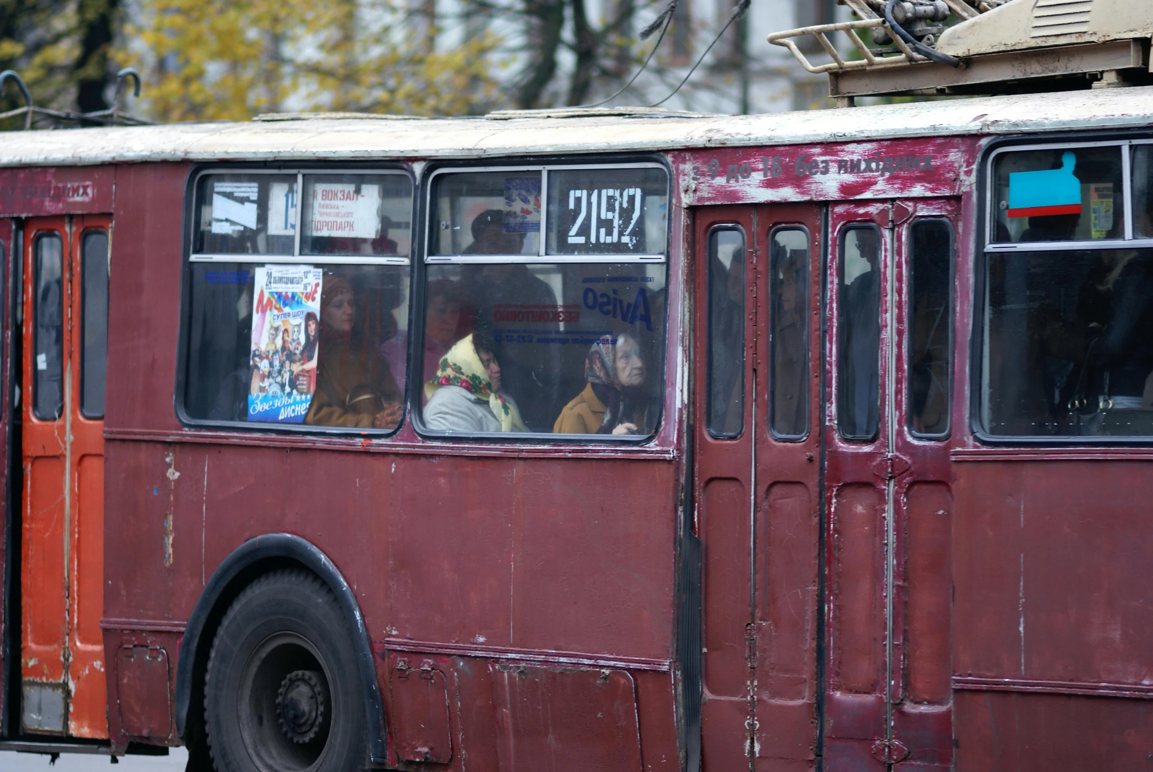 people in a tour bus in the city