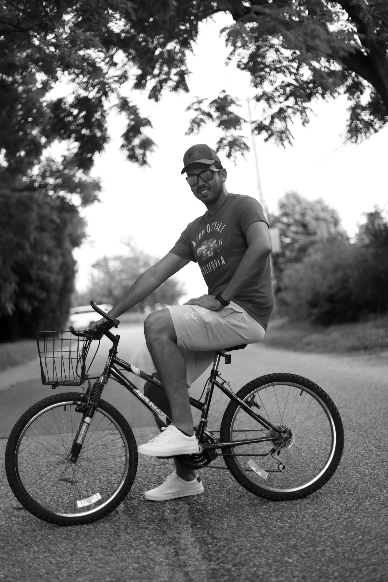 man sitting on bike with bicycle basket in the front