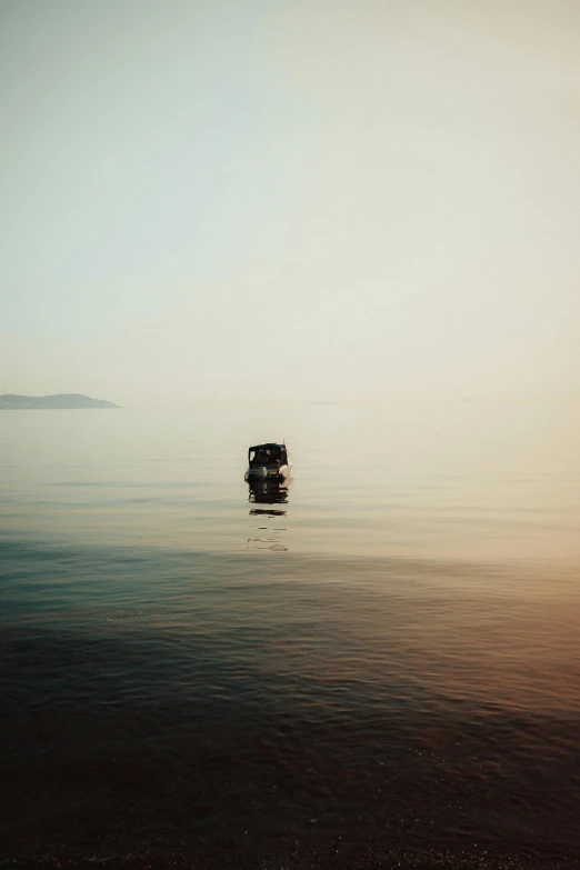 an old, dirty boat out on the water