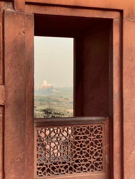 a stone window with a decorative cutwork around it