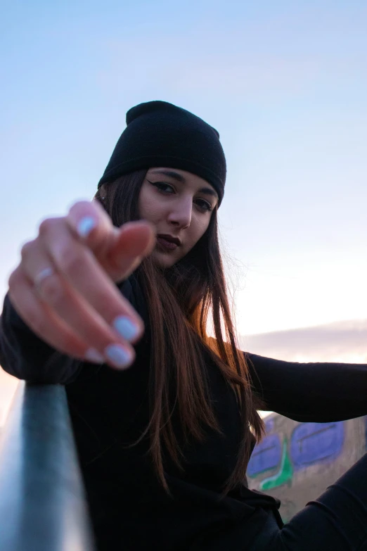 a girl with long hair posing for a po