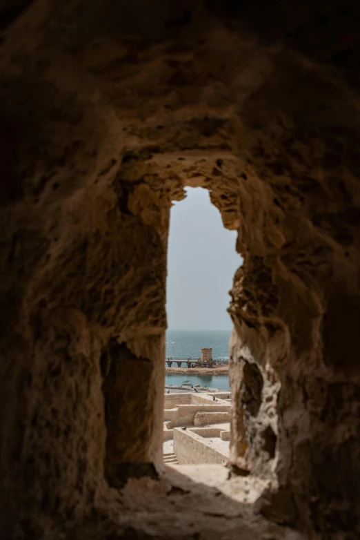 view of a very large body of water through an open tunnel