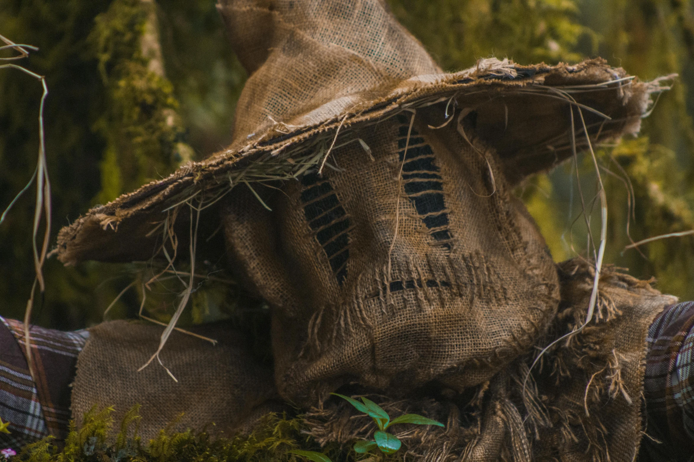 the hat is on top of the large piece of fabric