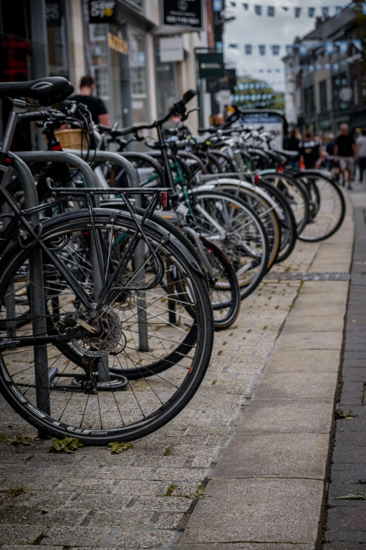 there are many bikes parked on the street