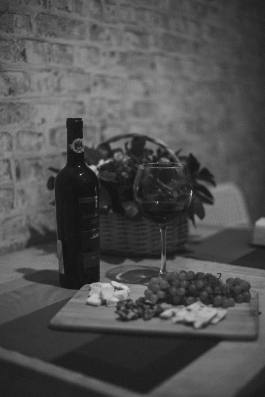 a bottle and glasses on a table