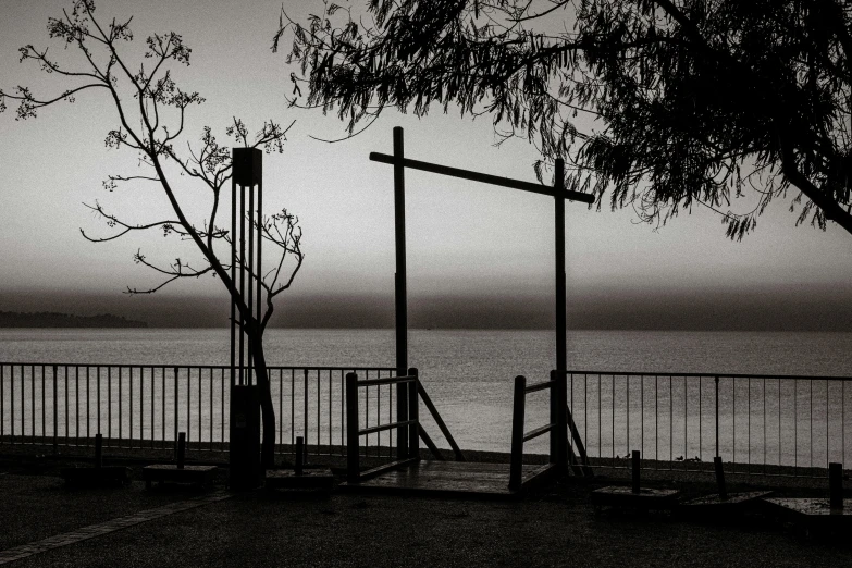 an empty park is shown with the water in the background