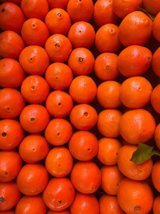 an orange that has been stacked up for sale