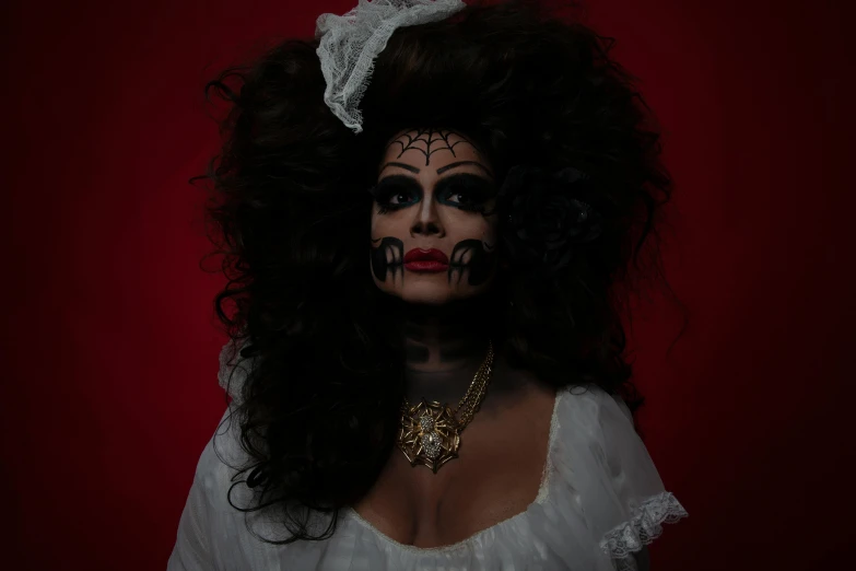 a woman with makeup painted black and white