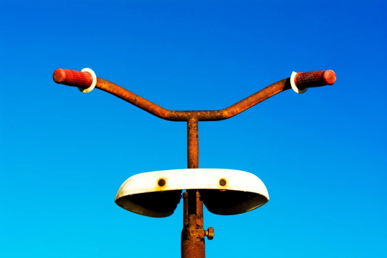 a traffic light with one red object on top of it