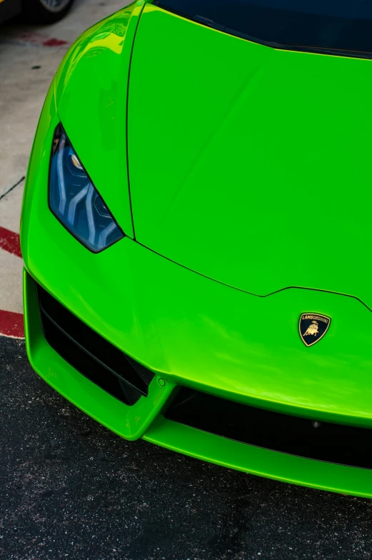 the front view of a bright green sports car