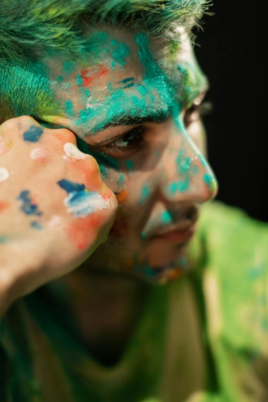 a young man with his face painted like flowers