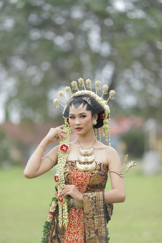 a woman with a crown and a necklace