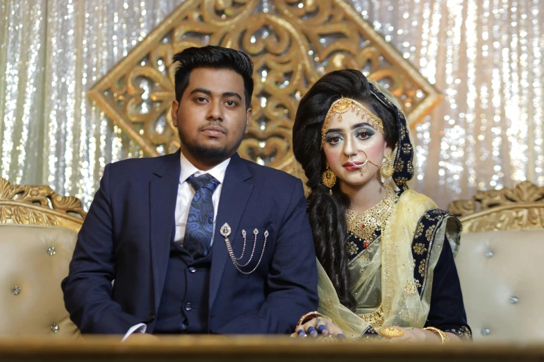 a couple dressed up for a traditional indian ceremony