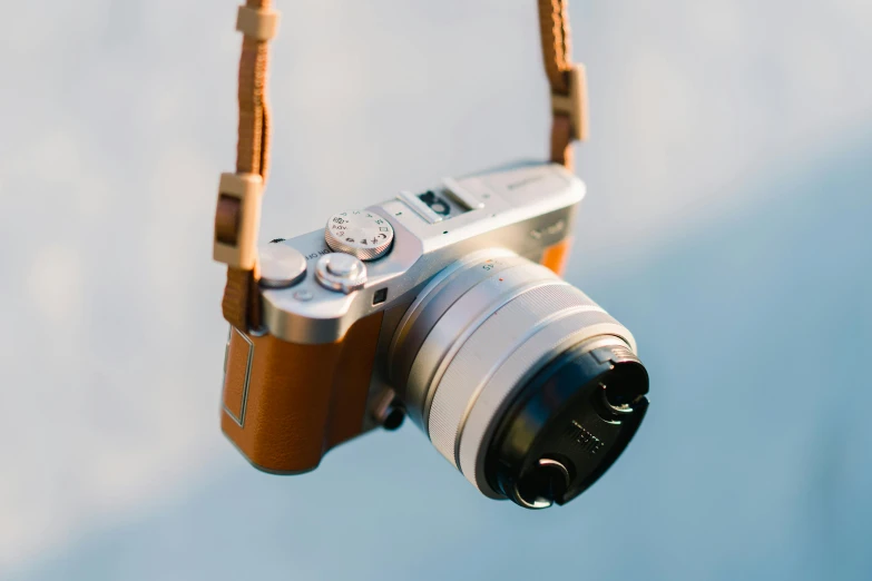 a camera being carried by someone who is holding it up