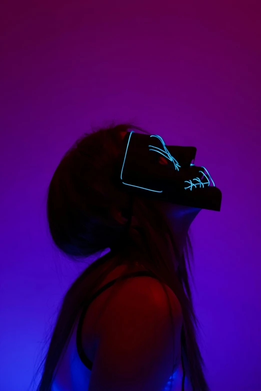 a girl wearing a glowing light up visor