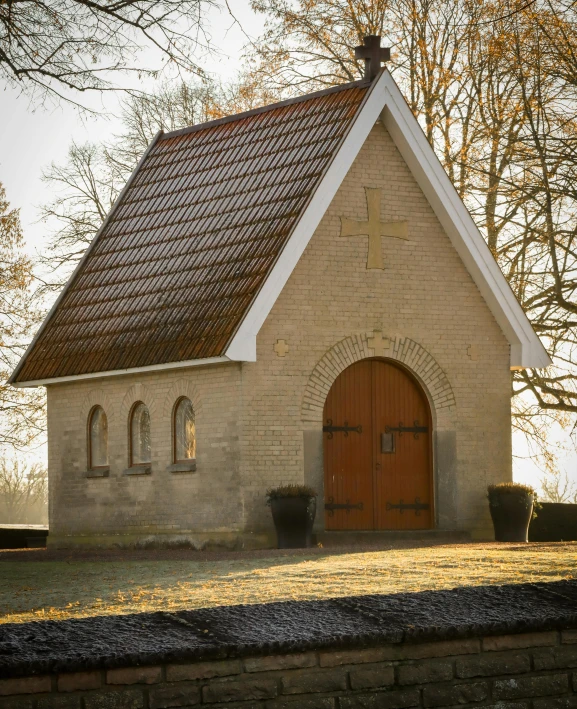 the church has brown brick and brown doors