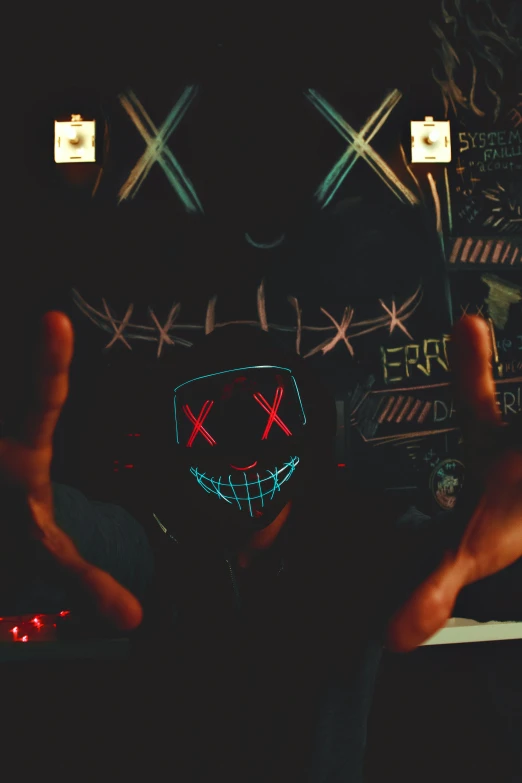 a person wearing a mask with a red light on them