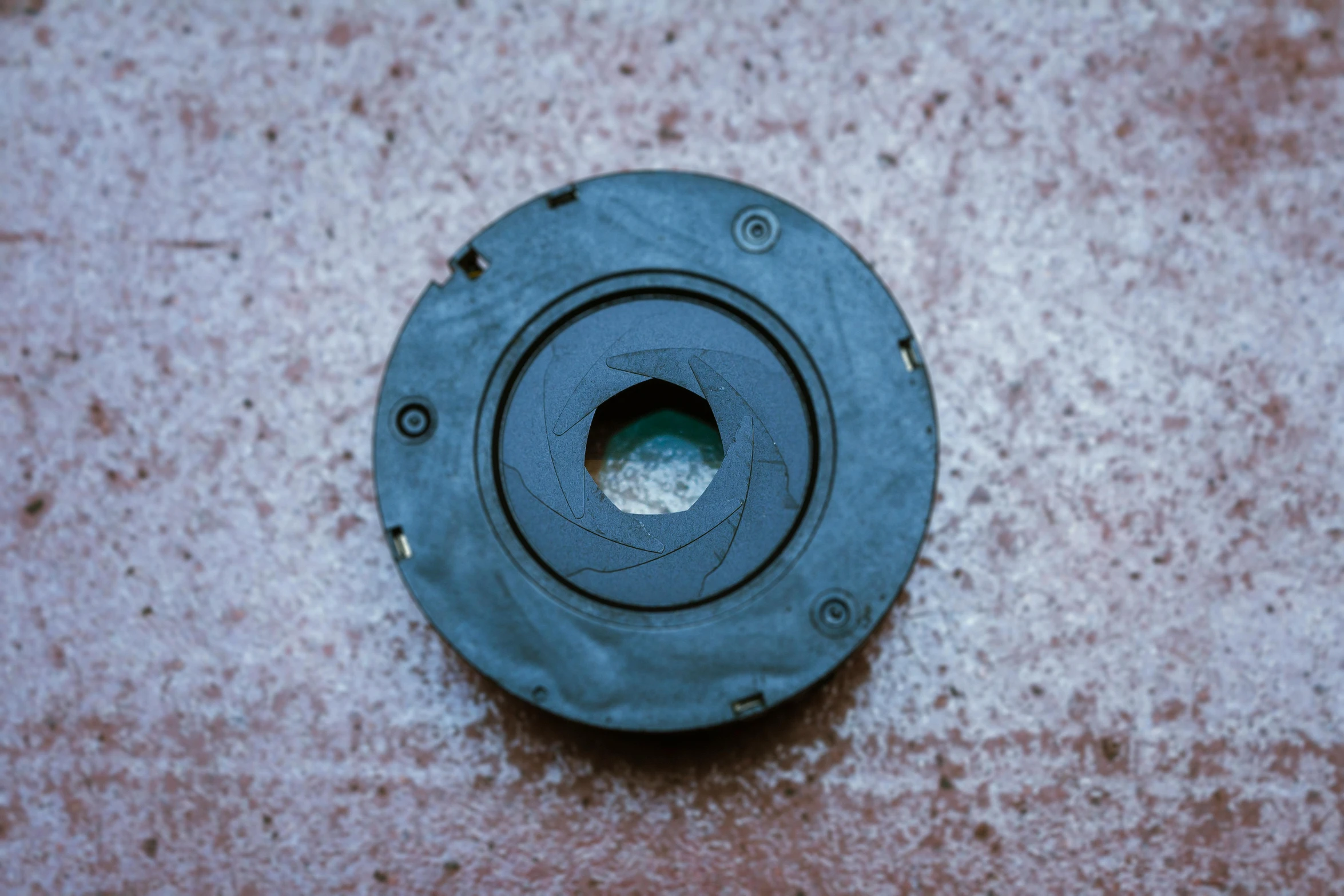 an object laying on top of a cement surface