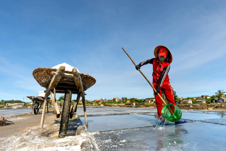 the person dressed in red is standing in an icy area