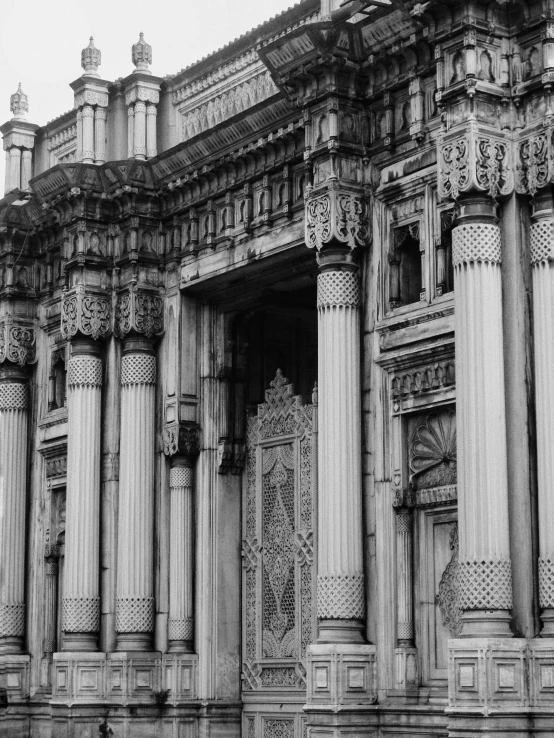 a large building with pillars and intricate carvings