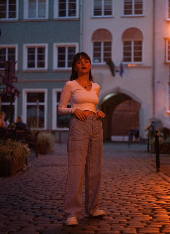 woman with closed eyes walking through city area