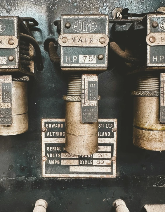 there are four old fashioned parking meters next to each other