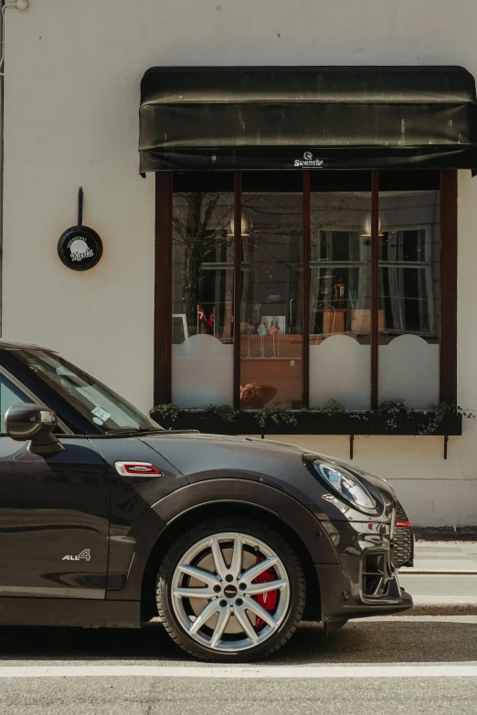 a car sits in front of the store