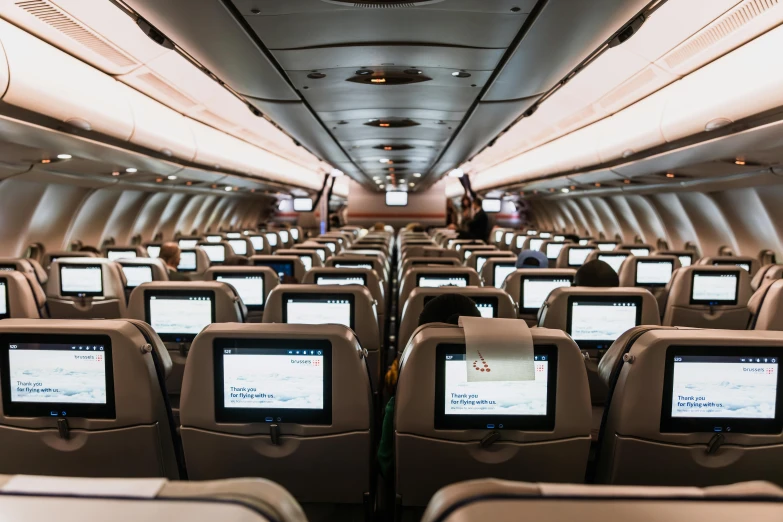 a plane with several monitors on the front rows