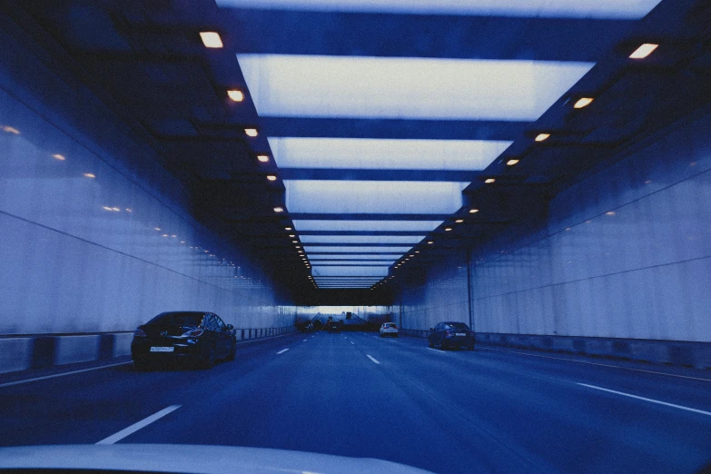 an empty parking garage with the lights on