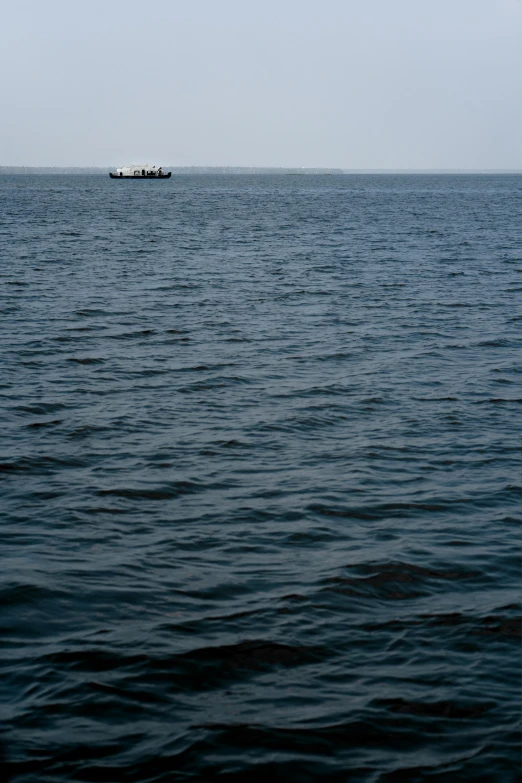 an ocean view shows two large boats in the distance