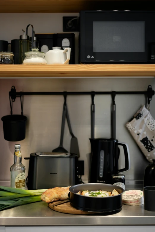 kitchen scene of pots, pans, pancake and pan