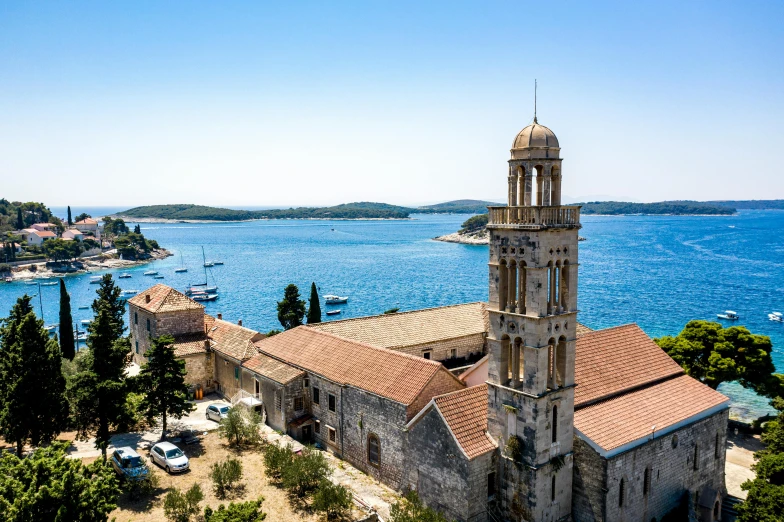 an old church is in the middle of an ocean