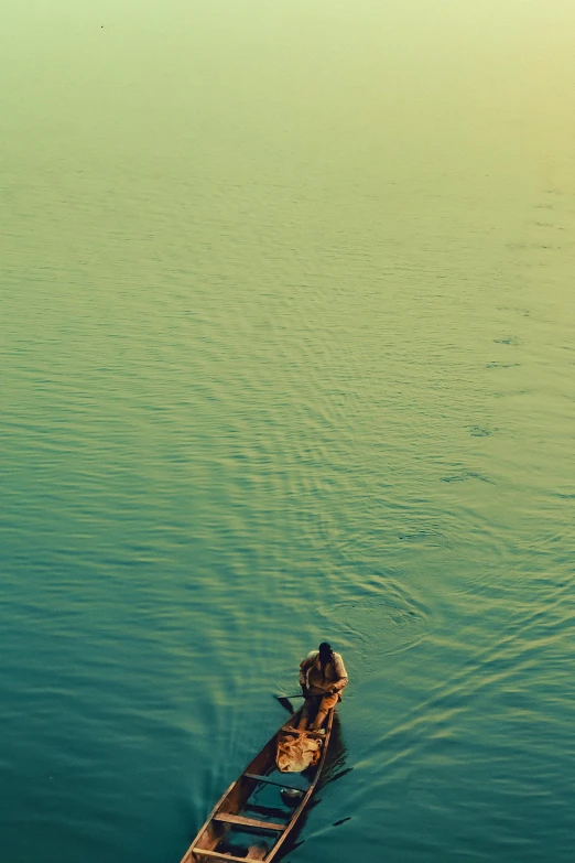 a boat sits in the middle of the water