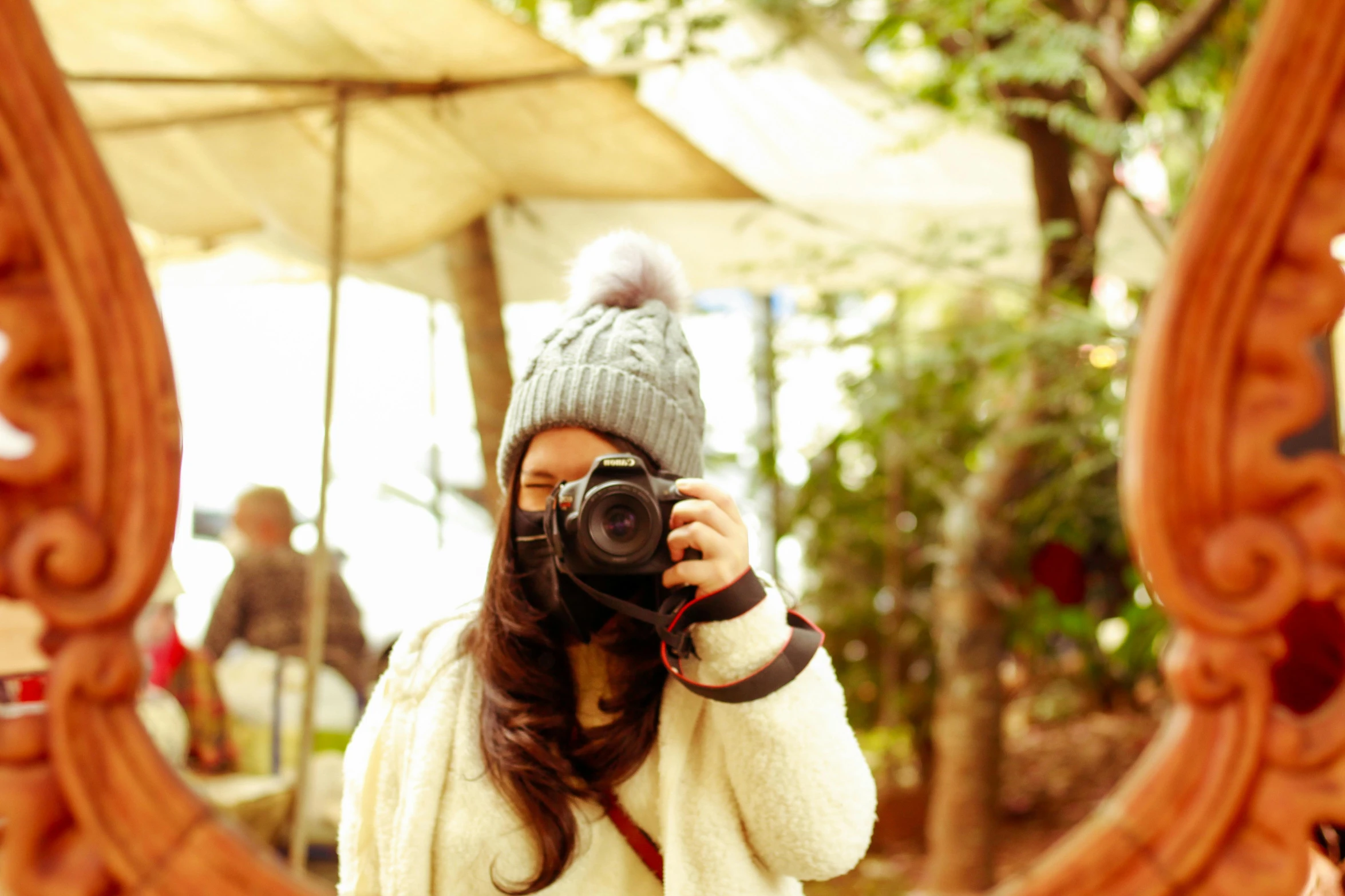 a woman taking a pograph with her camera