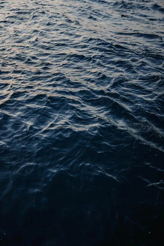 the surface of a lake with blue water