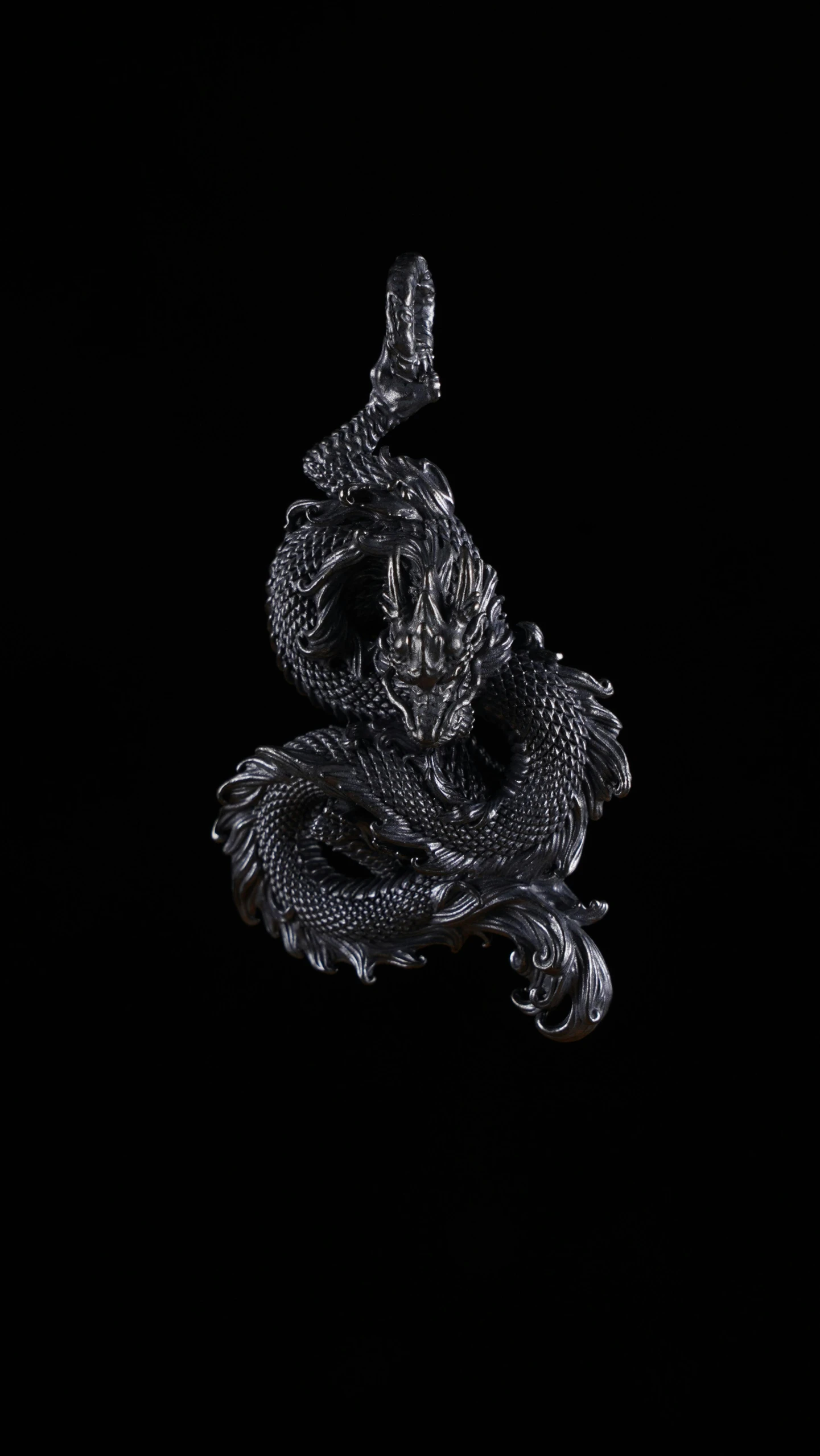 a silver and crystal broochle in the shape of a snake