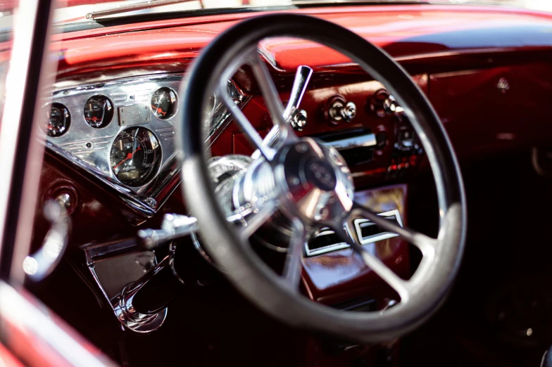 the interior of an old car with steering wheel