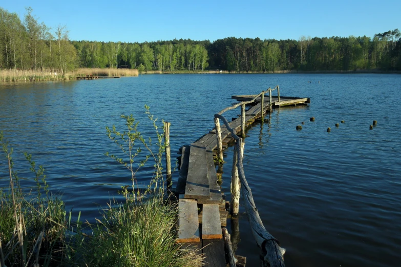 a couple of boats are on a small pier