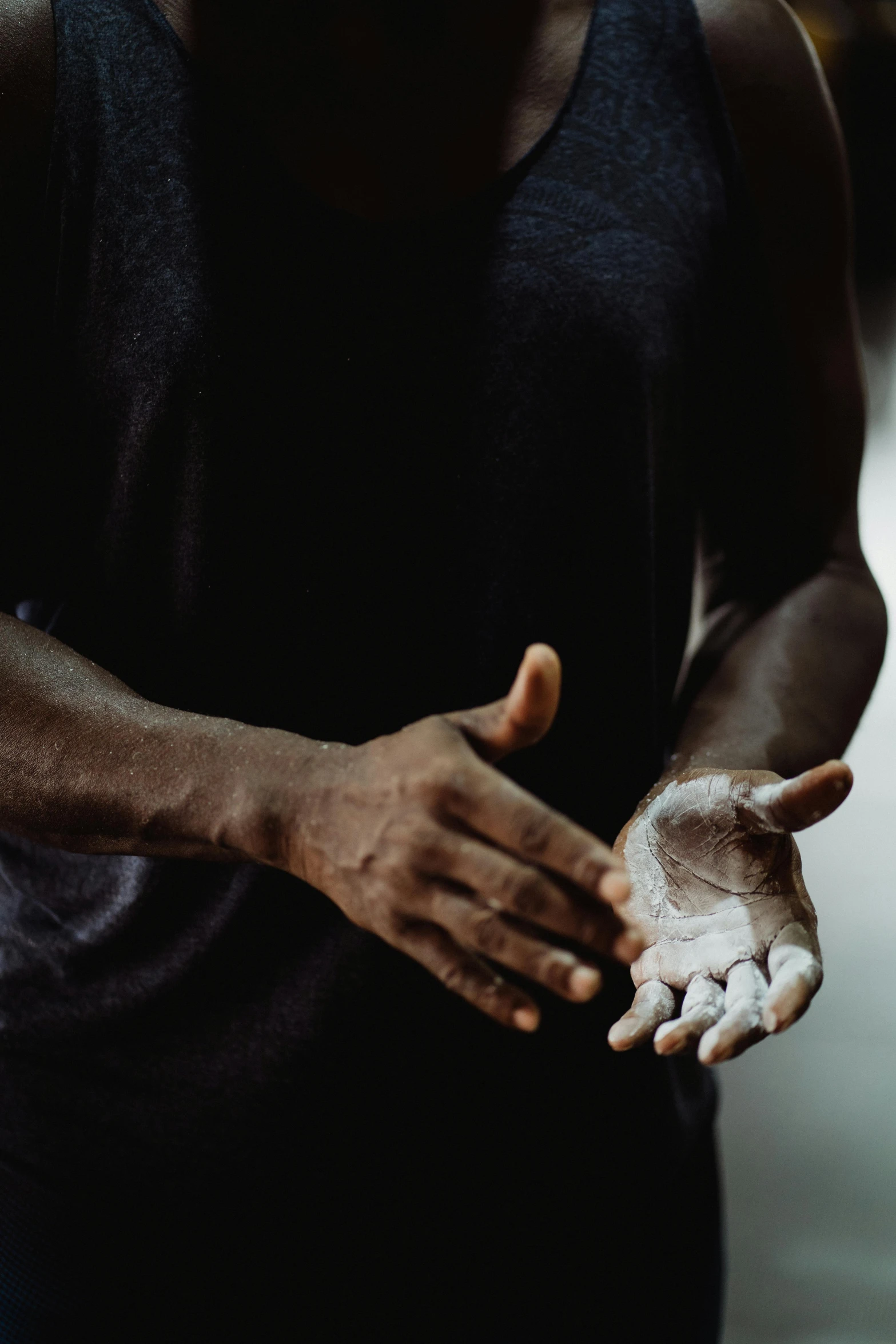 a close up of a person holding out his hands