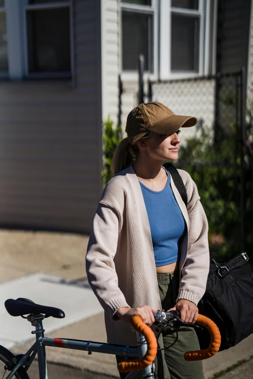 a girl smiles as she rides her bike in the street