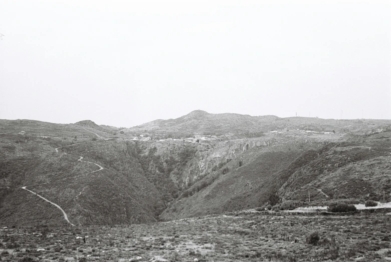 a black and white po of mountains in the desert