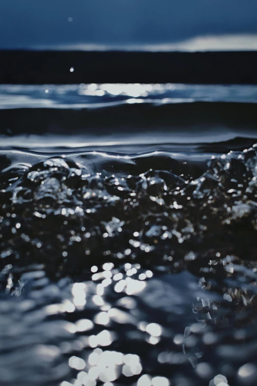 ocean water with reflections and the sun