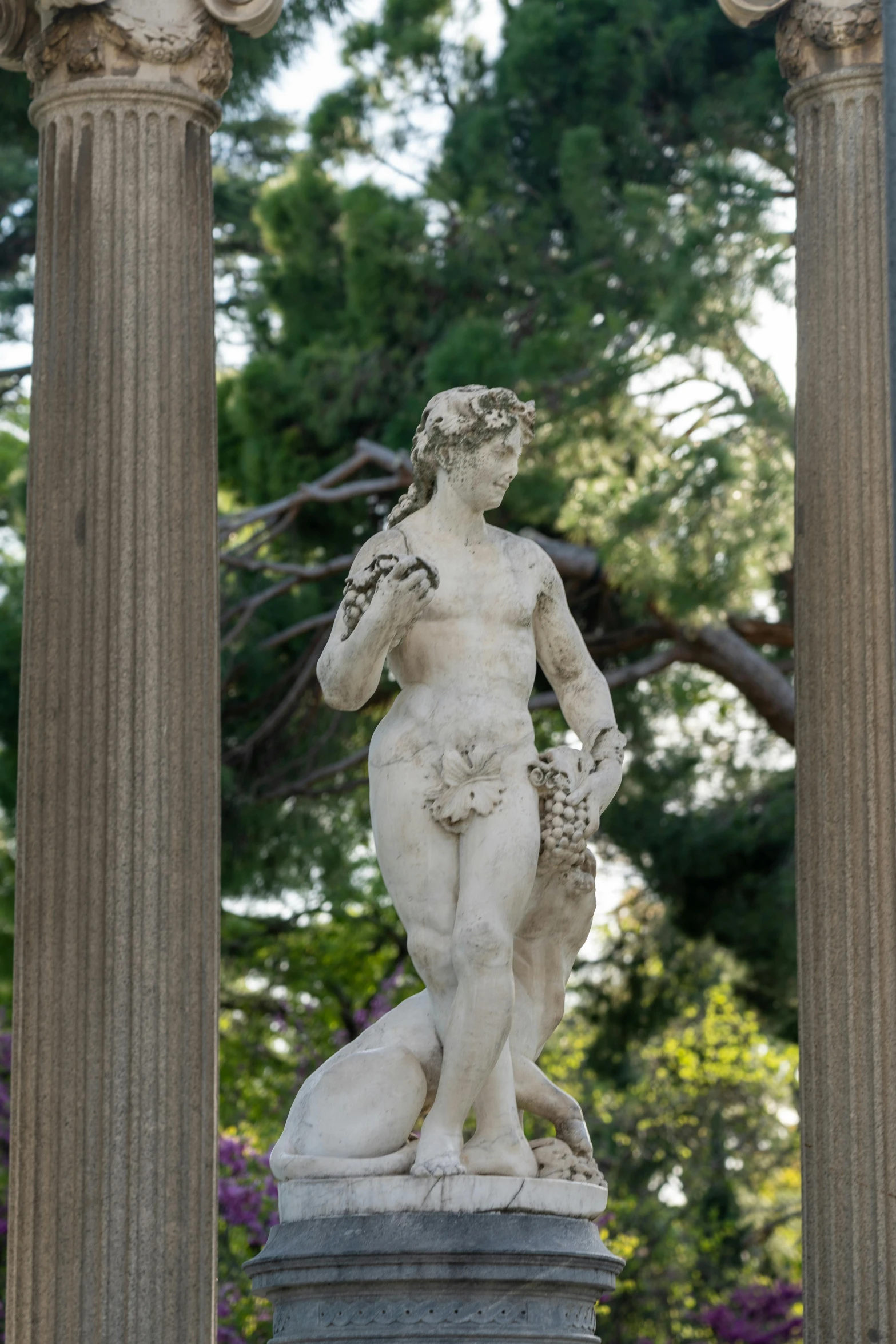 an elaborate white sculpture sits on top of the pedestal