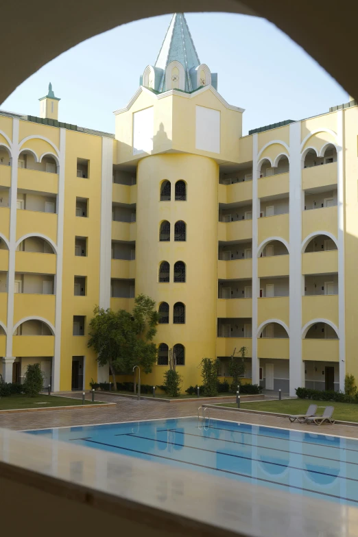 an image of a large swimming pool in front of a building